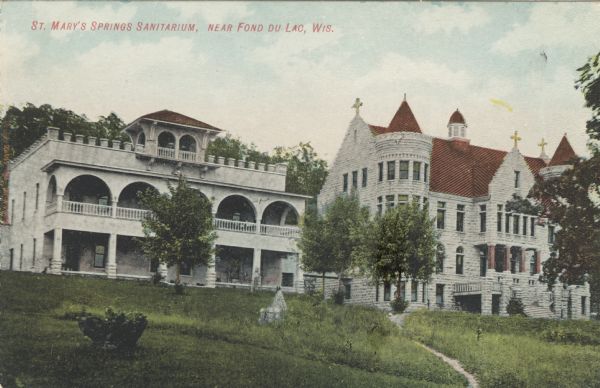 St. Mary's Springs Sanitarium — two stone buildings. One with turrets, and the other with a balcony. Caption reads: "St. Mary's Springs Sanitarium, near Fond du Lac, Wis."