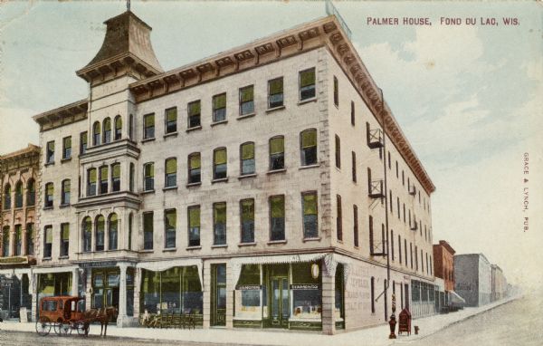 Vie across street towards the Palmer House hotel on the corner. There is a jewelry store on the corner. A horse and carriage are at the curb. Caption reads: "Palmer House, Fond du Lac, Wis."