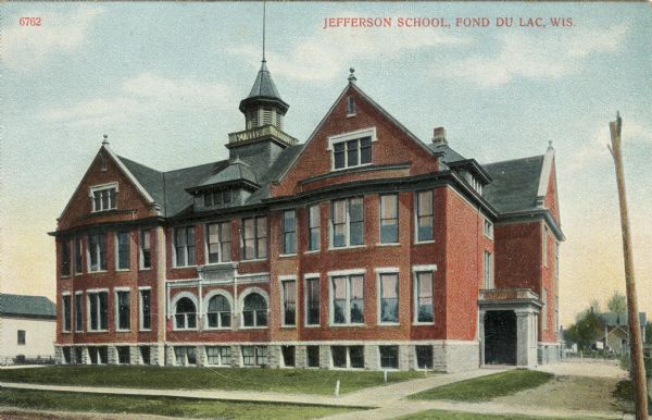 Exterior view of Jefferson School. Caption reads: "Jefferson School, Fond Du Lac, Wis."