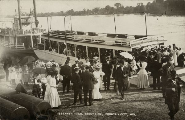 The steamer "Ideal" docked at Fountain City with passengers disembarking. Caption reads: "Steamer 'Ideal' Excursion, Fountain City, Wis."