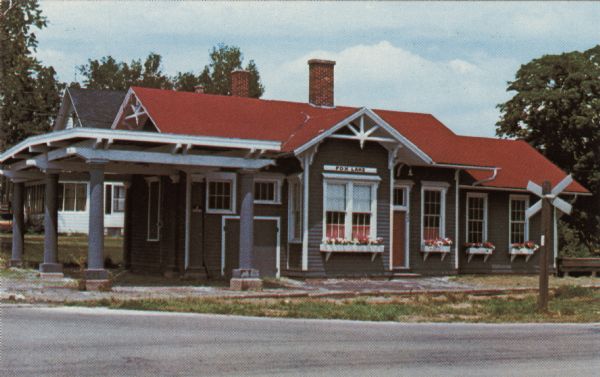 Text on reverse reads: "Fox Lake Historical Society Museum, Inc. Corner Cordelia & College Avenue Fox Lake, Wisconsin. Member State of Wisconsin Historical Society. Nominated to National Register of Historical Sites. Service began in 1884. Depot closed in 1970. Restoration and collection of local and railroad artifacts began 1974."