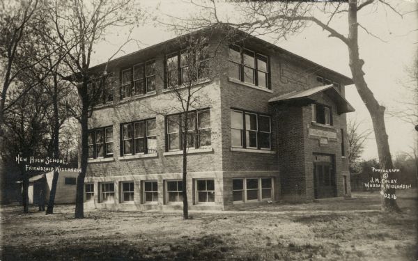 Corner view of the high school — a two-story brick building.