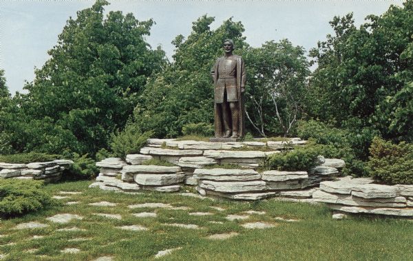 Text on reverse reads: "Near this spot the first white contact in the Northwest was made by Jean Nicolet at Red Banks in 1634. This memorial by Sidney Bedore, sculptor, was erected by the school children of Wisconsin June 3, 1951. Located on Route 57 near Green Bay, Wis."