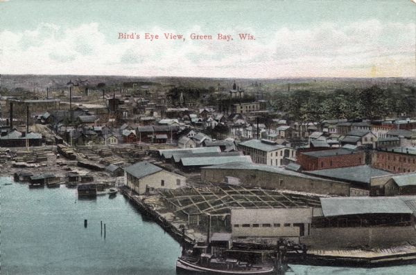 Bird's-eye view of Green Bay from the waterfront, with commercial buildings and factories. Caption reads: "Bird's Eye View, Green Bay, Wis."