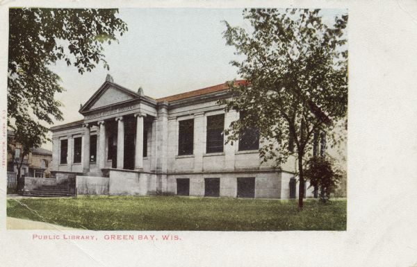 The Public Library, Carnegie Building 1902. There are steps up to the entrance, with a sign above the columns that reads: "Carnegie Building MDCCCCII" [1902]. Caption reads: "Public Library, Green Bay, Wis."