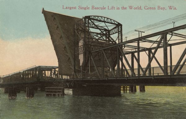 View of the Main Street drawbridge, the largest single bascule lift at that time. Caption reads: "Largest Single Bascule Lift in the World, Green Bay, Wis."