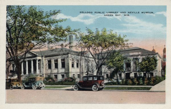 Colorized view of the library. Steps and columns are at the entrance. Automobiles are parked at the curb. Caption reads: "Kellogg Public Library and Neville Museum, Green Bay, Wis."