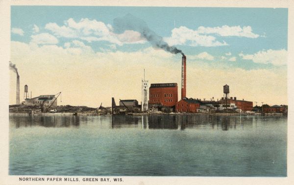 View of the Northern Paper Mill on the banks of the Fox River. Caption reads: "Northern Paper Mills, Green Bay, Wis."