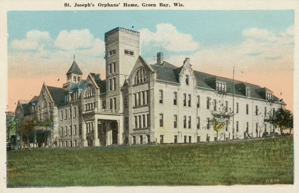 View of an orphanage with a tower. In existence between 1877 and 1980. Caption reads: "St. Joseph's Orphans' Home, Green Bay, Wis."