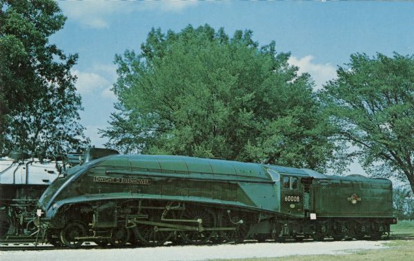 Color postcard of a green customized locomotive.

Text on reverse reads: "Famous Dwight D. Eisenhower Locomotive #60008. Built in London and N.E.R.R. in 1934. Given to R.R. Museum by British Railways Board, at South Hampton, England, April 27, 1964."