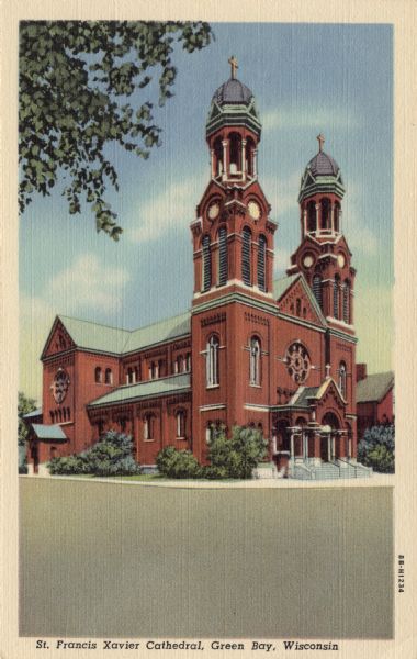 Colorized postcard view from street towards the St. Francis Xavier Cathedral on a street corner. A rose window is above the entrance, and there are two bell towers. Caption reads: "St. Francis Xavier Cathedral, Green Bay, Wis."