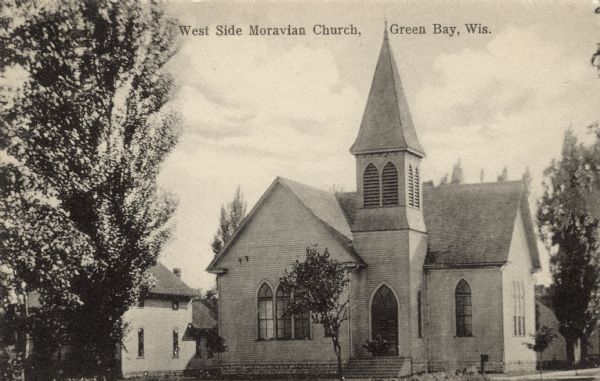 Wooden neighborhood church with a steeple. Caption reads: "West Side Moravian Church, Green Bay, Wis."