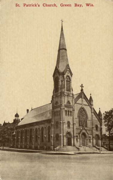 View from intersection towards St. Patrick's Church, with a steeple and Gothic arched windows. Caption reads: "St. Patrick's Church, Green Bay, Wis."