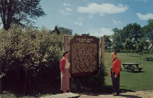 The Historical Marker for the Old Wade House State Park. A man and woman are standing in front of the sign, and in the background are picnic tables on a lawn.

"The official marker program was established by the Legislature in 1953 and use of this marker is restricted to sites and events of statewide or greater significance."