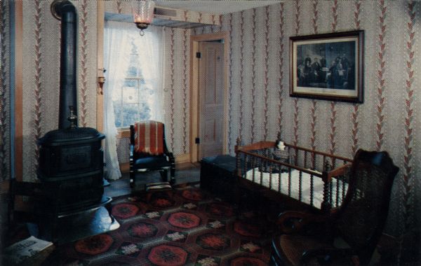 Ektachrome postcard of the Grey Parlor.

Text on reverse reads: "The Grey Parlor with the adjoining bedroom beyond the open door was the Hollis Wade suite. The four chairs have the original ingrain covering put on by Allie Wade, wife of Hollis."