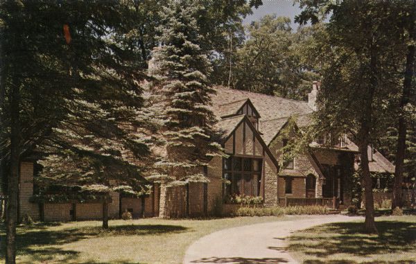 Color postcard view of the Writing Center, a stone building with several gables.

Text on reverse reads: "This lovely setting is for those desiring a quiet spot for meditation and writing. A new complete library is included in the Center."