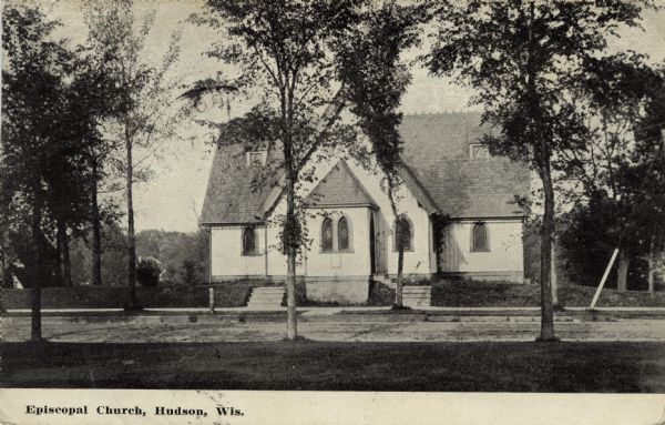 View of the Episcopal Church, a wooden church with two entrances. Caption reads: "Episcopal Church, Hudson, Wis."