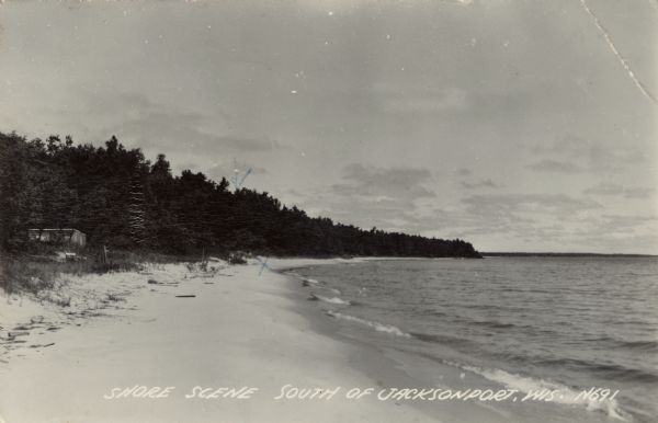 View along the Lake Michigan sandy shoreline. Caption reads: "Shore Scene, South of Jacksonport, Wis."