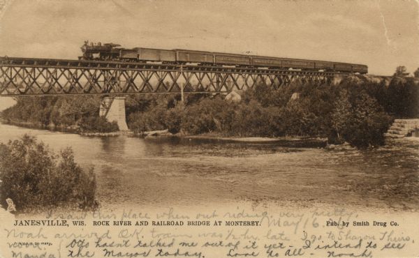 View of a railroad bridge and a passenger train crossing the Rock River. Caption reads: "Janesville, Wis. Rock River and Railroad Bridge at Monterey."
