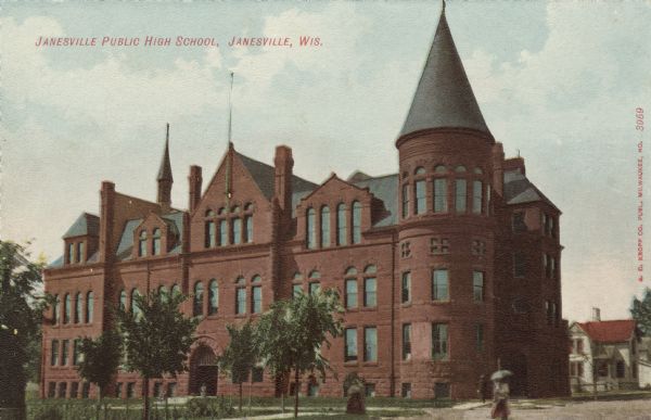 View of the high school, which has a turret and an arched entrance. Caption reads: "Janesville Public High School, Janesville, Wis."