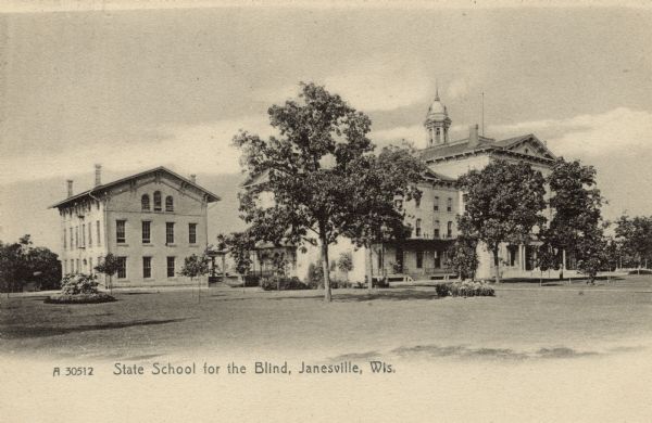 View across lawn towards the buildings comprising the School for the Blind. Caption reads: "State School for the Blind, Janesville, Wis."