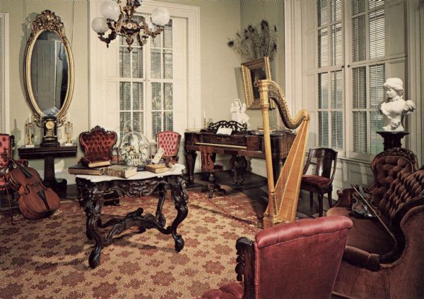 Interior of the room where visitors to the Tallman House were greeted formally. Musical instruments are arranged around.