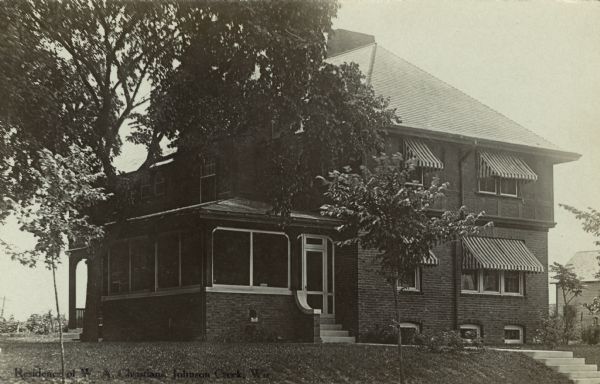 Photographic postcard view of a two-story brick house, home of W.A. Christians, a local printer. Caption reads: "Residence of W.A. Christians, Johnson Creek, Wis."