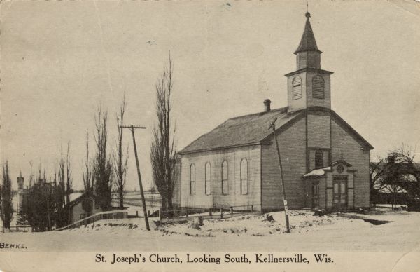 View of a church surrounded by snow. Buildings are in the background. Caption reads: "St. Joseph's Church, Looking South, Kellnersville, Wis."