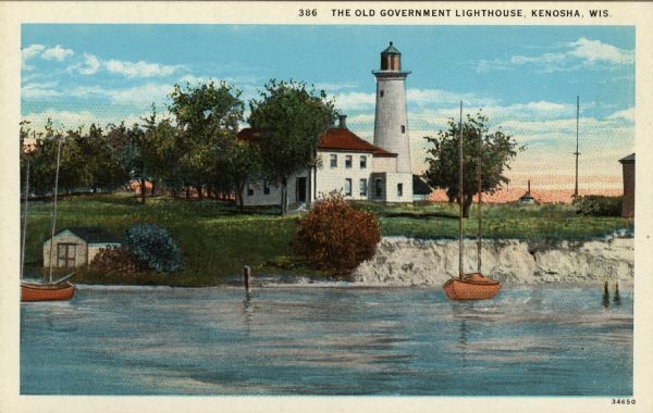 Illustration of a view across water towards a lighthouse and adjoining dwelling. Small boats are moored in the harbor. Caption reads: "The Old Government Lighthouse, Kenosha, Wis."