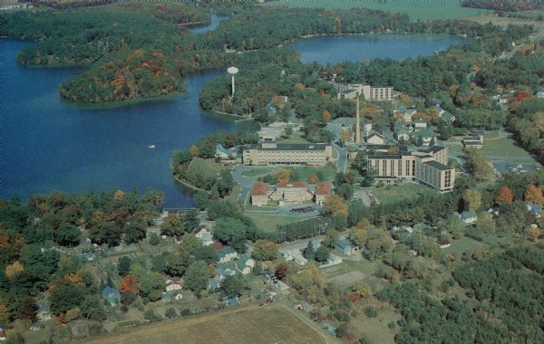 Aerial view of the Wisconsin Veterans' Home campus beside Chain O' Lakes and the village of King.

Text on reverse reads: "Founded in 1887 by The Grand Army of the Republic, the Wisconsin Veterans Home provides a magnificent blend of beauty, history and state-of-the-art nursing care and retirement options for Wisconsin's wartime veterans."