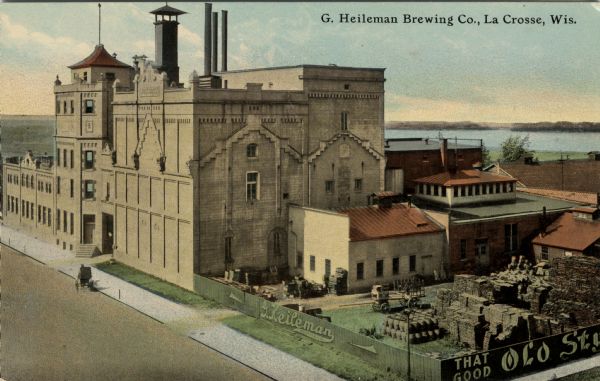 Colorized view of an elevated view of the brewery beside the Mississippi River. Caption reads: "G. Heilman Brewing Co., La Crosse, Wis."