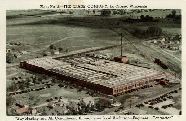 Aerial view of The Trane Company, manufacturer of heating, cooling and air conditioning equipment. Caption reads: "Plant No. 2 &#8212; The Trane Company, La Crosse, Wis." At bottom: "Buy Heating and Air Conditioning through you local Architect — Engineer — Contractor."