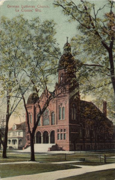 Colorized view of the German Lutheran Church. Three arches with columns are at the entrance, and a bell tower is on the right corner. Caption reads: "German Lutheran Church, La Crosse, Wis."