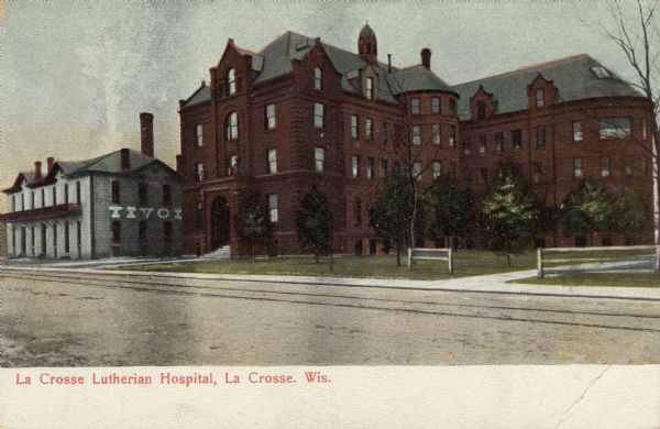 View across street towards the Lutherian Hospital. Caption reads: "La Crosse Lutherian Hospital, La Crosse, Wis."
