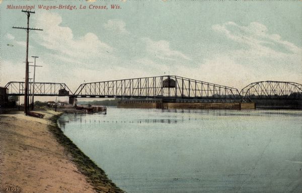 Hand-colored view from shoreline looking towards the wagon bridge crossing the Mississippi River at La Crosse. Caption reads: "Mississippi Wagon-Bridge, La Crosse, Wis."