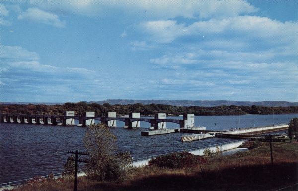 Kodachrome postcard of elevated view of a dam on the Mississippi River near La Crosse.