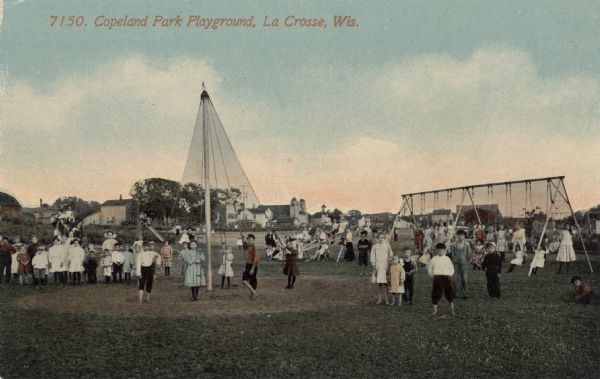 Hand-colored view of a group of children at a playground with swings, see-saws and a slide. Caption reads: "Copeland Park Playground, La Crosse, Wis."