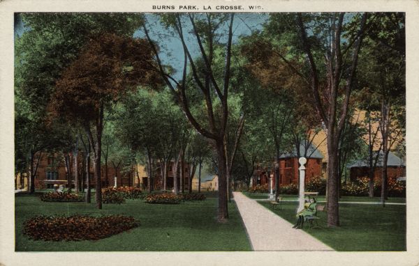 Hand-colored view of a shady park with several flower beds in the lawn. Two girls are sitting on a bench along the sidewalk. Caption reads: "Burns Park, La Crosse, Wis."