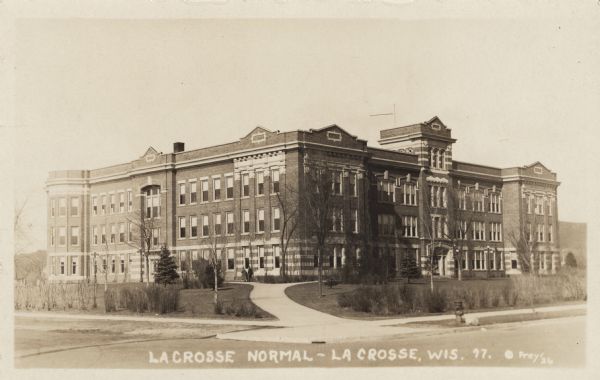 Photographic postcard view of the Normal School, an original building for the University of Wisconsin-La Crosse located at 1724 State Street. Caption reads: "La Crosse Normal — La Crosse, Wis."