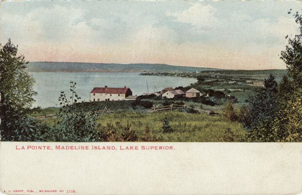 Hand-colored view of a small community on the shore of Lake Superior.