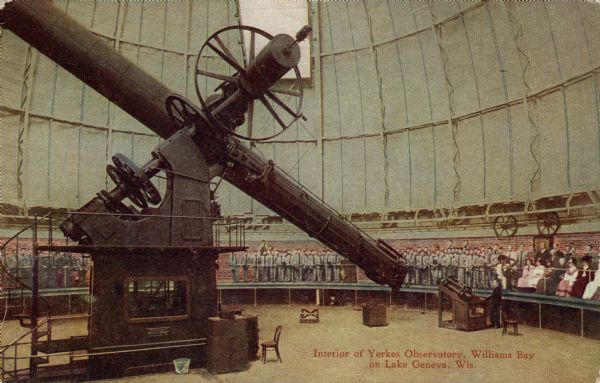 View of the gallery and telescope in Yerkes Observatory. A crowd of spectators are standing around the room. Caption reads: "Interior of Yerkes Observatory, Williams Bay on Lake Geneva, Wis."