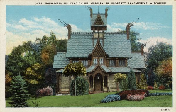 View of a stave church, with carved dragon gargoyles. Caption reads: "Norwegian Building on Wm. Wrigley Jr. Property, Lake Geneva, Wis."