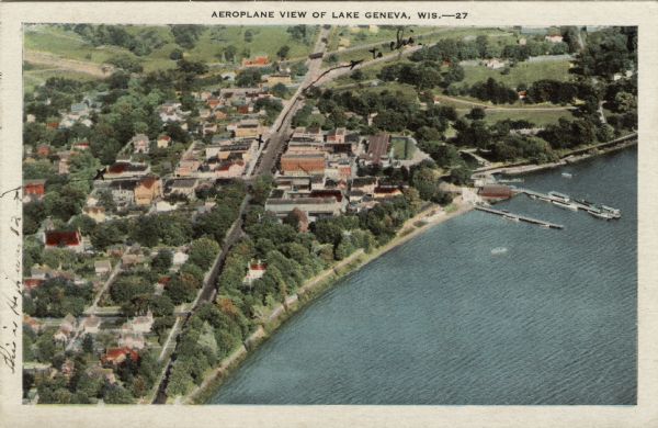 Aerial view of Lake Geneva (town) next to Lake Geneva (lake). Caption reads: "Aeroplane View of Lake Geneva, Wis."