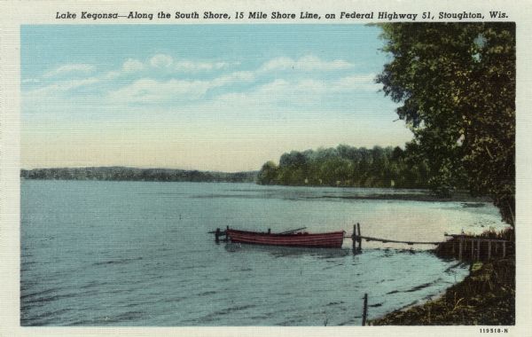 View from shoreline of Lake Kegonsa. There is a small rowboat tied to a dock on the right. Caption on front reads: "Lake Kegonsa — Along the South Shore, 15 Mile Shore Line, on Federal Highway 51, Stoughton, Wis."