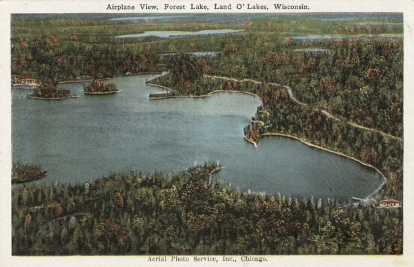 Aerial view of Forest Lake and surrounding lakes. Caption reads: "Airplane View, Forest Lake, Land O' Lakes, Wis." Text on back reads, in part: "Come, see beautiful Forest Lake, virgin nature's gem in the forest primeval."