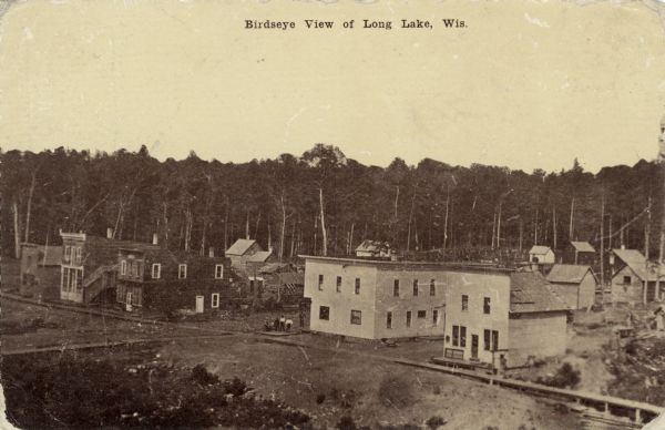 Elevated view of central Long Lake and a row of unidentified businesses. Caption reads: "Birdseye View of Long Lake, Wis."
