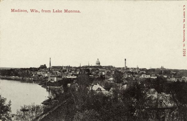 Elevated view of the near east side of the Isthmus with Laka Monona on the left. The Capitol dome is on the horizon. Caption reads: "Madison, Wis. from Lake Monona."