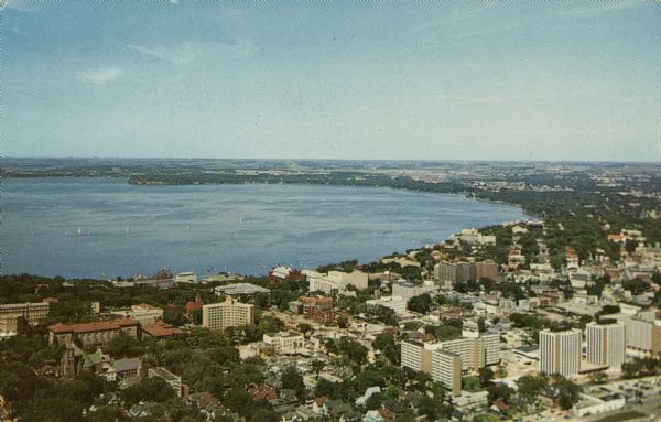 Aerial view of the UW Campus and Lake Mendota. Memorial Library, Historical Society, and Red Gym in the center.