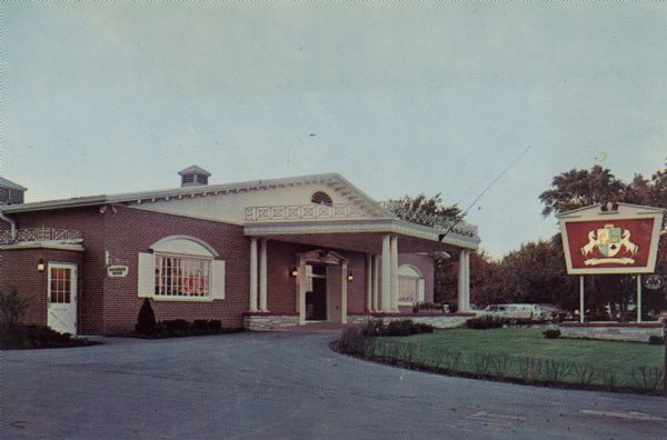 Exterior view of a restaurant once located at 3520 E. Washington Avenue. There is an electric sign with two unicorns in front. Columns frame the roofed entrance. A sign at the corner near a doorway reads: "Rainbow Room." Text on back reads: "Excitingly new from top to bottom, the Embers carries on the well-known tradition of the Ace of Clubs. Be sure to stop the very next time you're in the Capitol City."