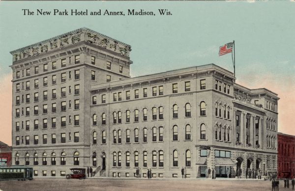 Color illustration of the hotel on the corner of South Carroll Street and Main Street. A streetcar is on the left. Caption Reads: "The New Park Hotel and Annex, Madison, Wis."